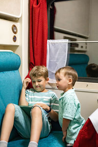 Cute kids sitting in train