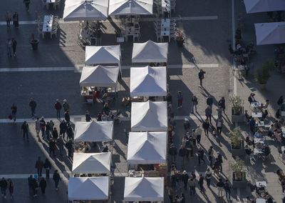 High angle view of people walking on city street