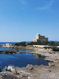 Scenic view of sea against clear blue sky