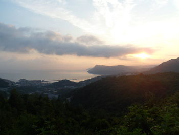 Scenic view of mountains against sky during sunset