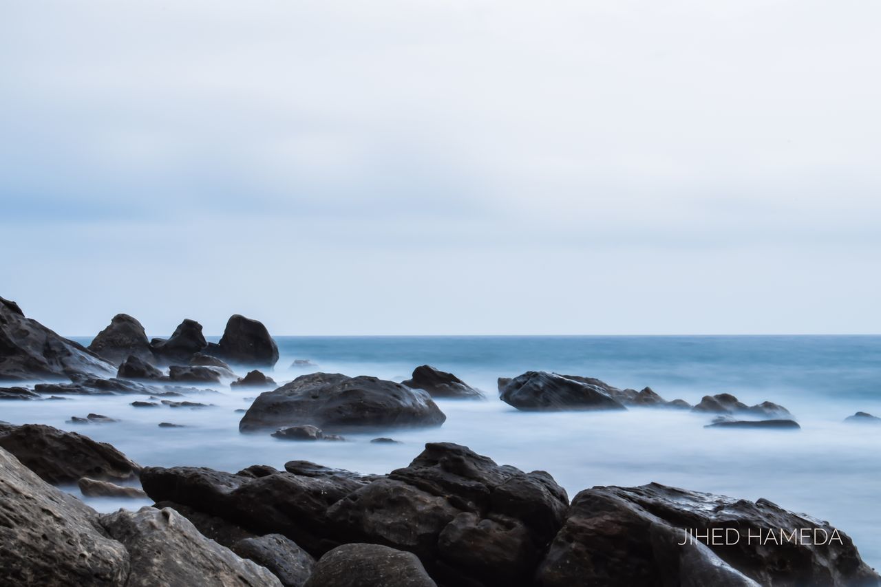 VIEW OF ROCKS IN SEA