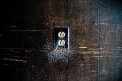 Close-up of smiley face on wood