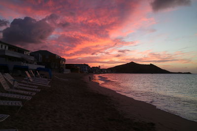 Scenic view of beach against sky during sunset