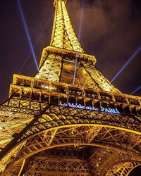 Low angle view of illuminated eiffel tower