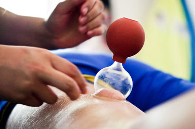 Close-up of man holding hands