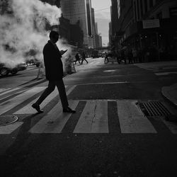 Man walking on street in city