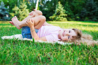 Full length of woman lying down on land