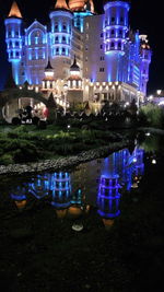 Illuminated lights on grass at night