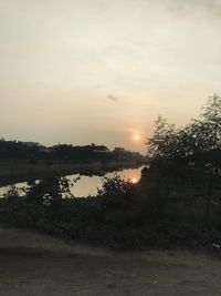 Scenic view of lake against sky during sunset