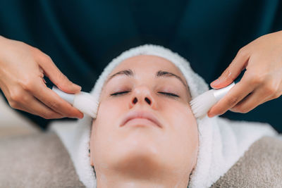 Close-up of woman getting massage therapy at spa