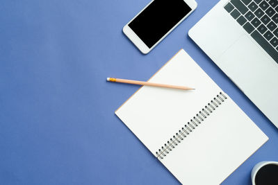 High angle view of pencil and book on table