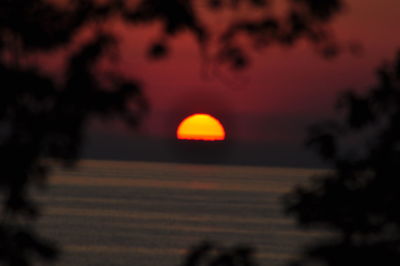 Scenic view of landscape against sky at sunset