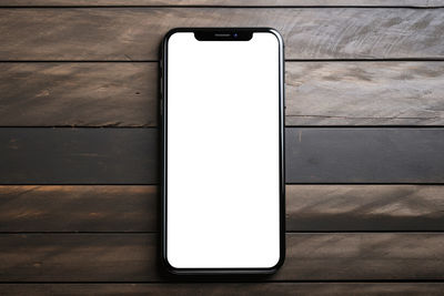 High angle view of mobile phone on table