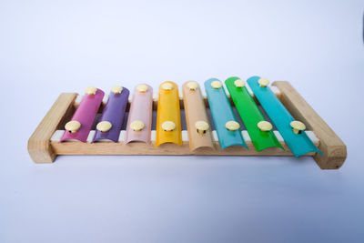 Close-up of multi colored pencils against white background