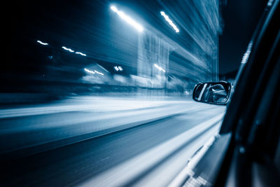 Blurred motion of car on street at night
