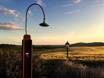 Shower head with lamppost at agricultural landscape 