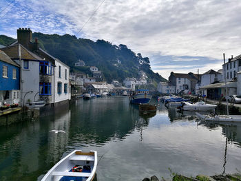 Boats moored at harbor