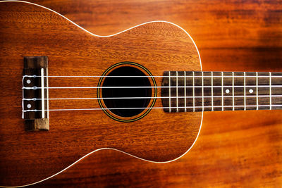 Close-up of guitar on table