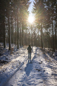 Man standing on snow covered landscape