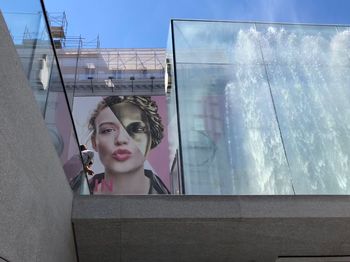 Low angle view of female poster on billboard