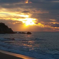 Scenic view of sea at sunset