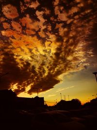 Silhouette landscape against scenic sky