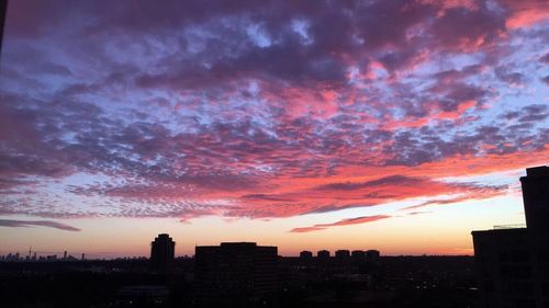 Dramatic sky over city during sunset