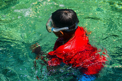 High angle view of man swimming in water