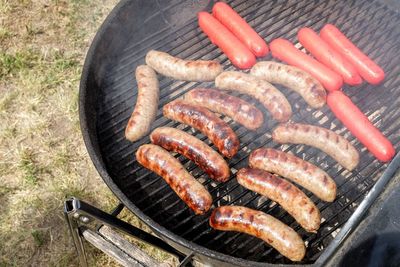 High angle view of meat on barbecue grill