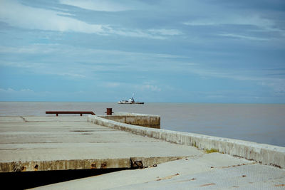 Pier on sea against sky