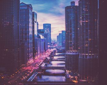 Illuminated buildings in city at night