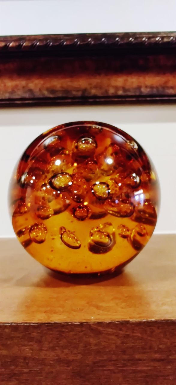 HIGH ANGLE VIEW OF PUMPKIN IN CONTAINER ON TABLE