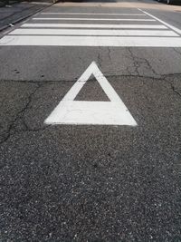 High angle view of arrow sign on road