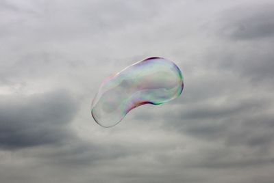 Low angle view of bubbles against sky