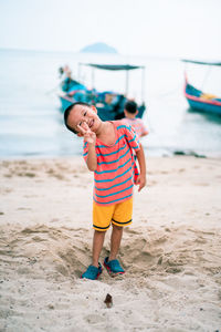 Full length of boy on beach