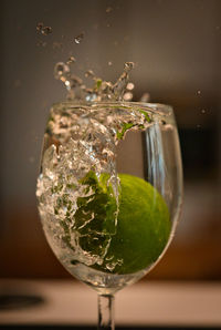 Close-up of wine in glass on table