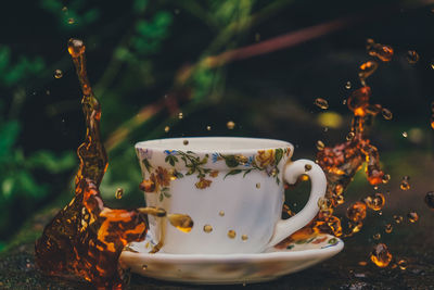 Close-up of coffee cup on table