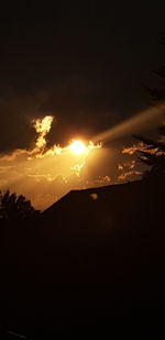 Scenic view of silhouette mountains against sky during sunset