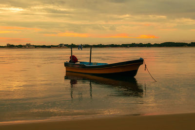 Scenic view boats at shela beach at sunset in lamu town, unesco world heritage site in kenya
