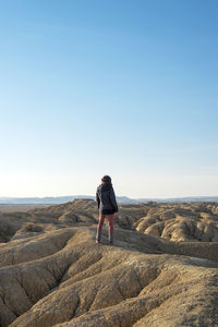 Full length of man standing on rock