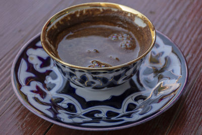 High angle view of coffee cup on table