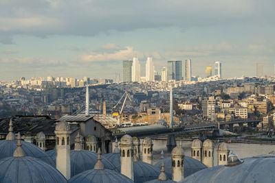 Buildings in city against sky