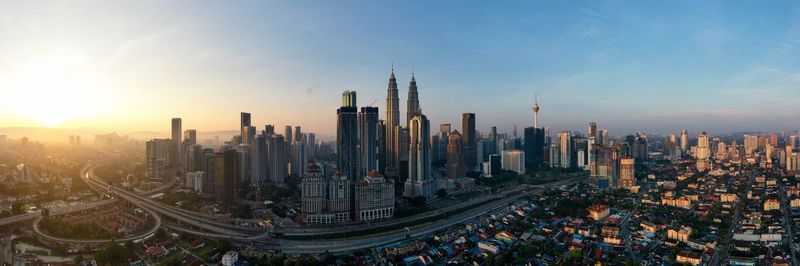 Panoramic view of buildings against sky during sunset