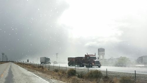 View of road against cloudy sky