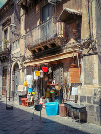 Chairs and tables against buildings in city