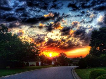 Scenic view of road against cloudy sky
