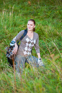 Beautiful woman standing on field outdoors