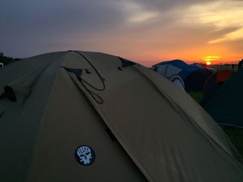 Tent against sky at sunset