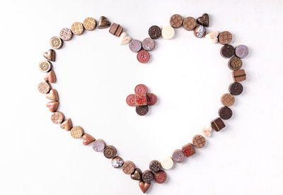 High angle view of heart shape made on white background