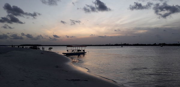 Scenic view of sea against sky at sunset